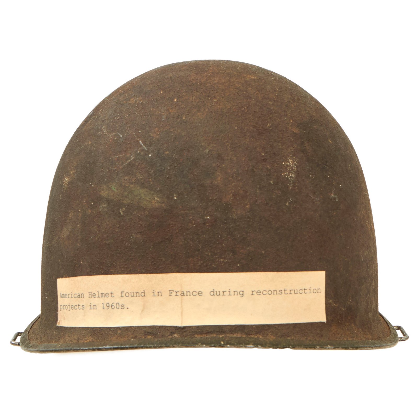 Buy Original U.S. WWII Bullet Struck McCord Front Seam Swivel Bale M1 Helmet With Museum Tag - Ground Dug During French Reconstruction Ca 1960 | Original Firearms Antique For Sale