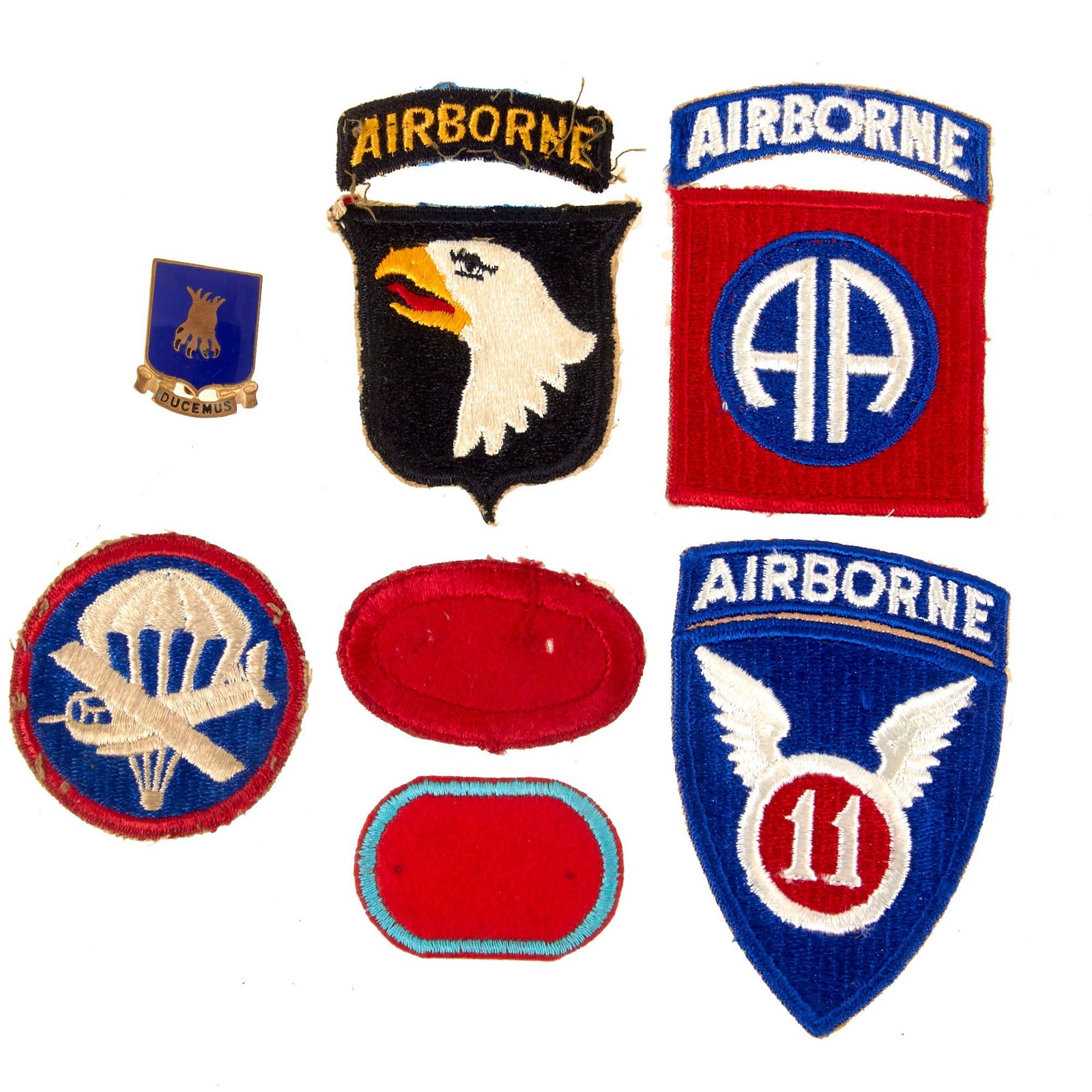 Original U.S. WWII Airborne Patch & Insignia Lot - 101st & 82nd Divisions, 501st & 101st Artillery Ovals & 22nd Bombardment Group DI - 7 Pieces Total