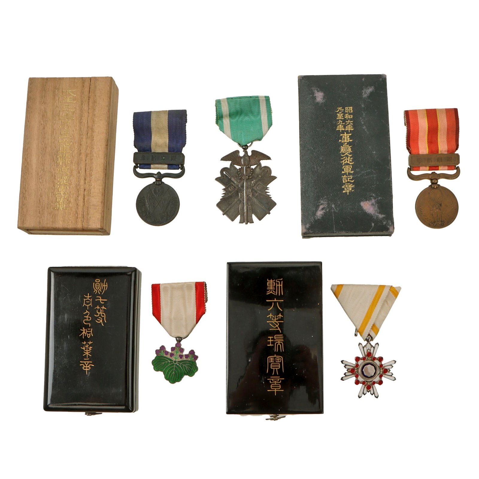 Original Japanese WWII Lot of Five Medals with Four in Original Boxes - Order of the Golden Kite, Order of the Sacred Treasure, Order of the Rising Sun, Great War Commemorative Medal, and Manchurian Incident Medal