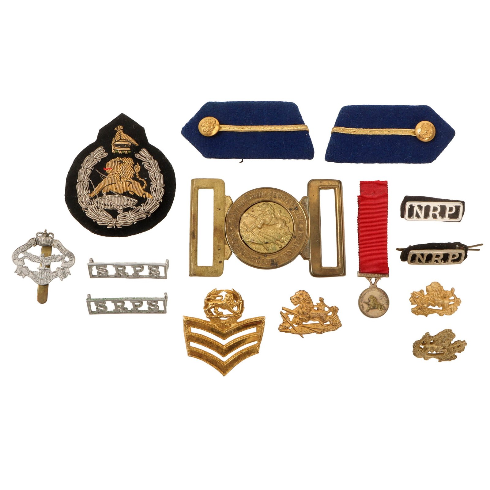 Original Rhodesian Bush War to Modern Era Military Insignia Lot with Collar Tabs, Belt Buckle, & Bullion Cap Badge