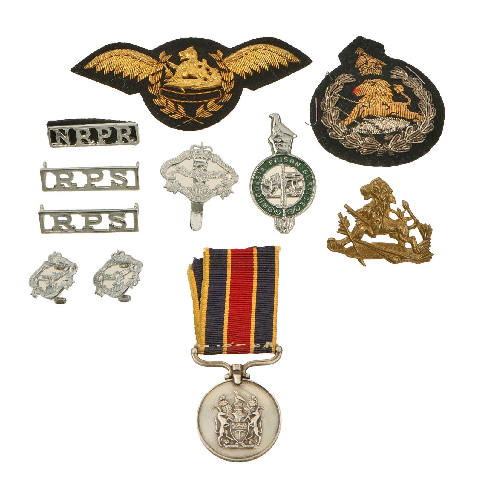 Original Rhodesian Bush War to Modern Era Military Insignia Lot with Medal, Belt Pins, & Patches