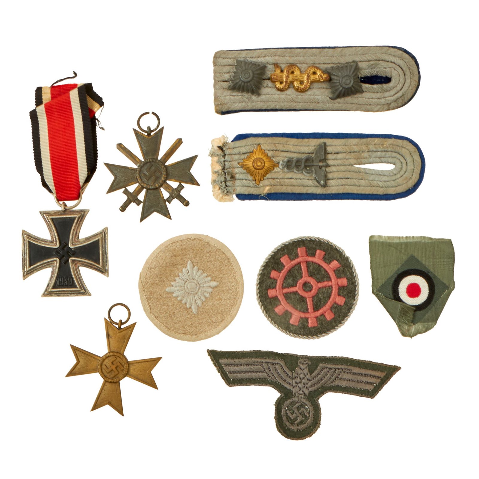 Buy Original German WWII Medal and Insignia Grouping with EKII 1939, KvKII with Swords, and KvKII without Swords - 9 Items | Original Firearms Antique For Sale